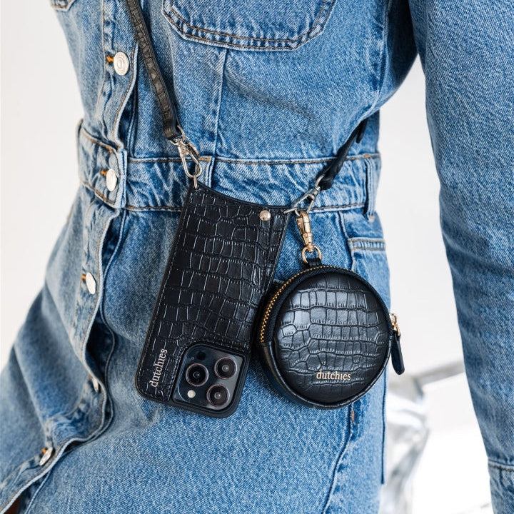 Stylish accessories from the Noir Collection, showcasing a black crocodile pattern phone case and coin purse.