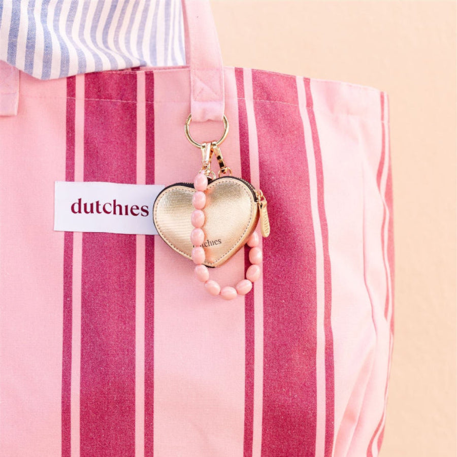 Pink phone charm made of high-quality beads attached to a pink and red striped tote bag.