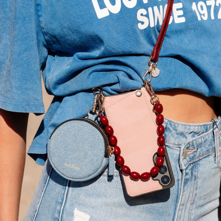 Phone Charm | Beaded | Charley displayed on a stylish outfit with a cute coin purse.
