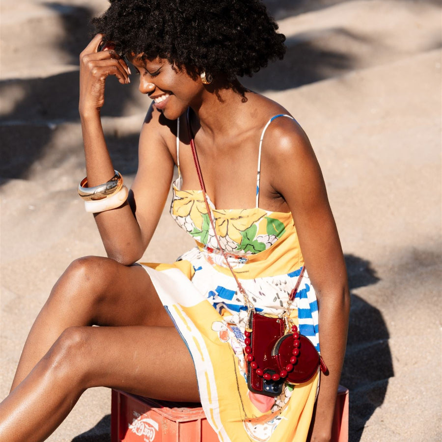 Phone Charm | Beaded | Charley showcased on a cheerful model in vibrant summer attire, radiating joy and style.