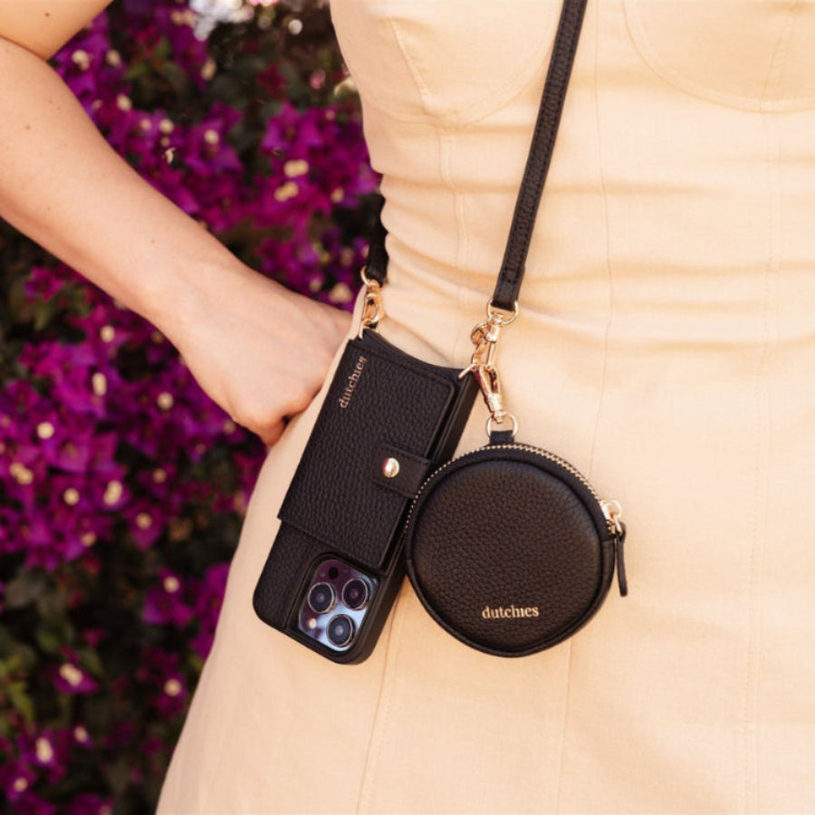 Mini Phone Bag Emma | Black hanging stylishly alongside a phone case, perfect for essentials on the go.