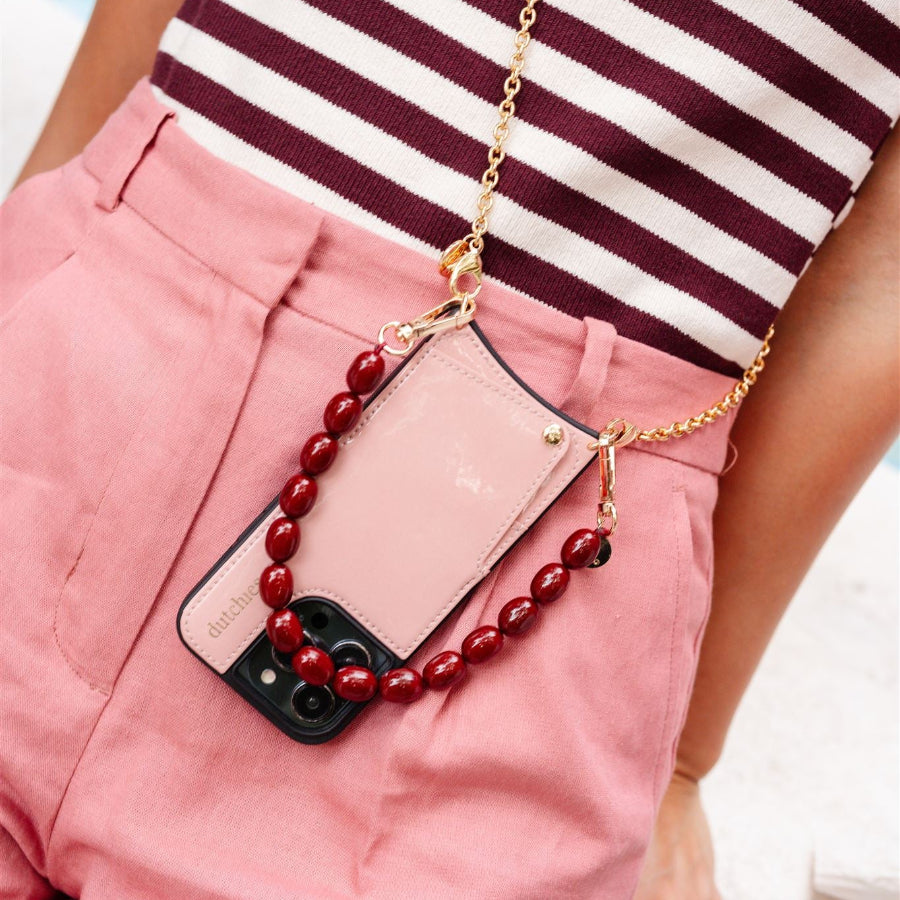 Phone Charm | Beaded | Charley showcasing a stylish beaded phone charm attached to a chic phone case.