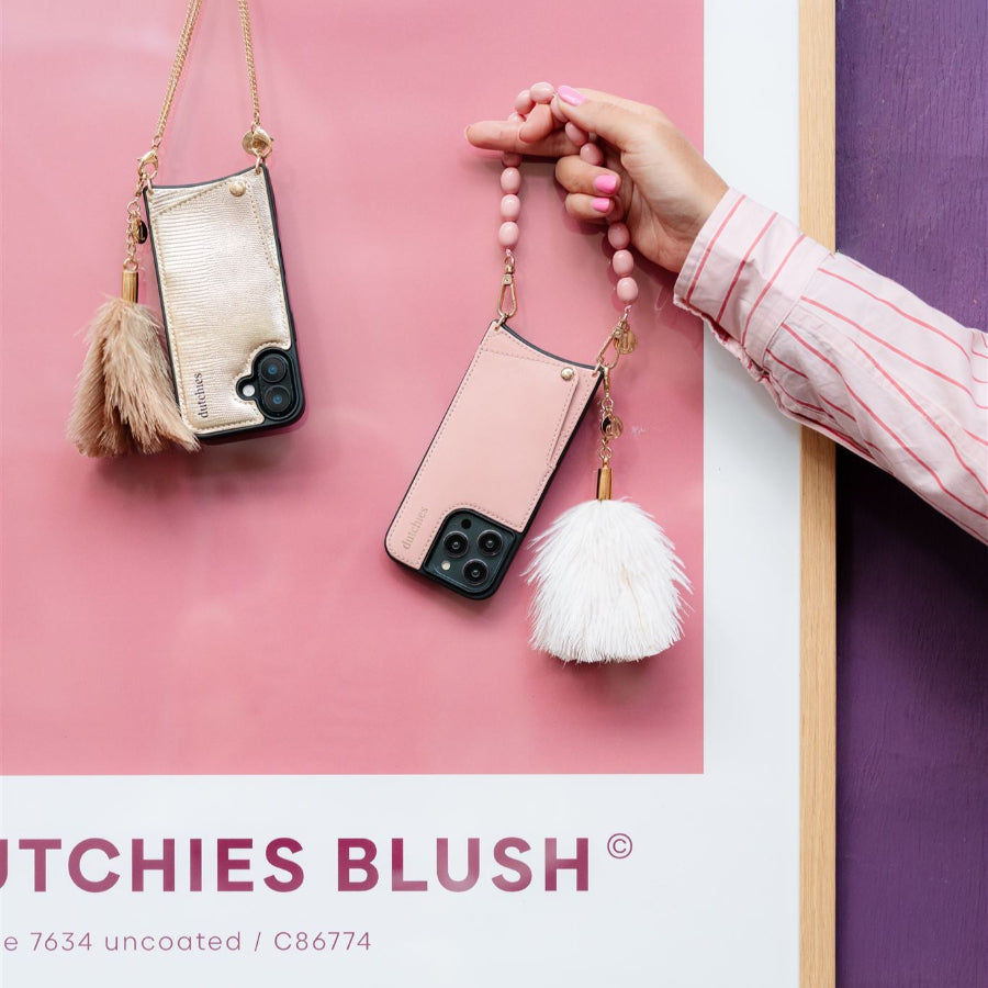Vavavoom | Keychain showcasing fluffy charm on a phone case with cardholder in a stunning pink and gold design.