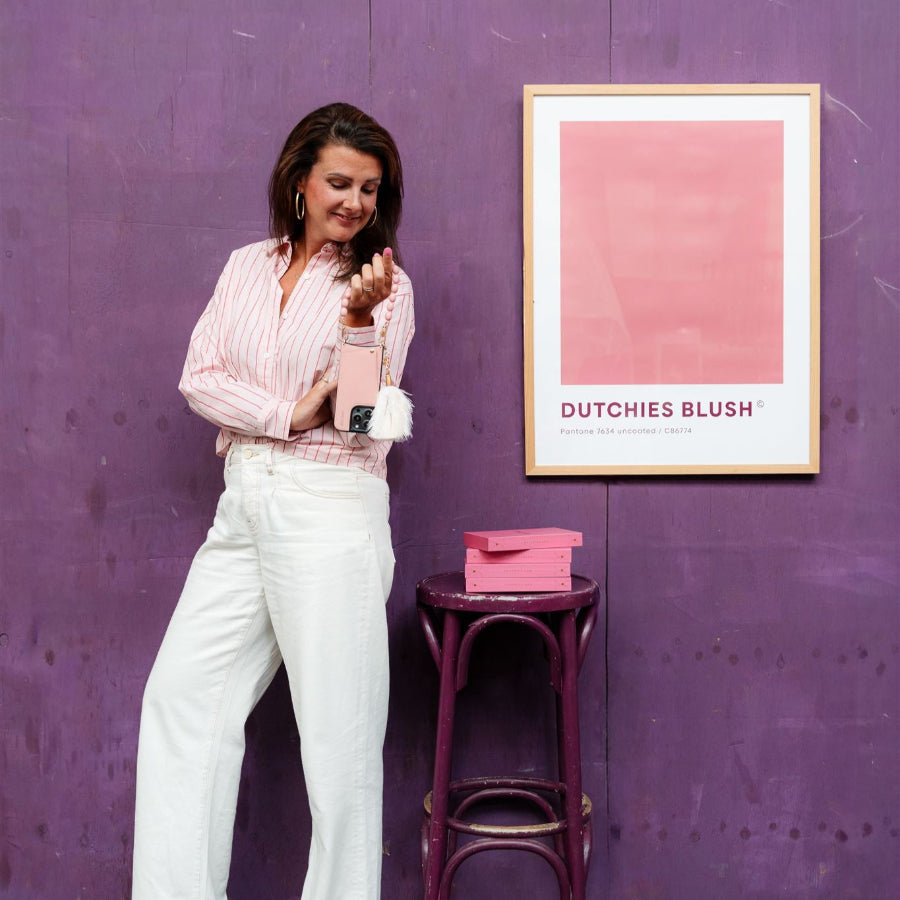 Vavavoom | Keychain displayed on a phone case with cardholder, paired with a stylish outfit and artwork backdrop.