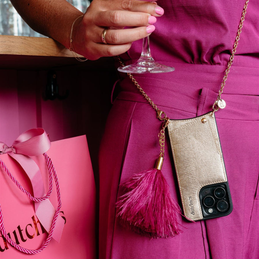 Vavavoom | Keychain attached to a phone case with cardholder in Burgundy color, adding flair and style to the look.