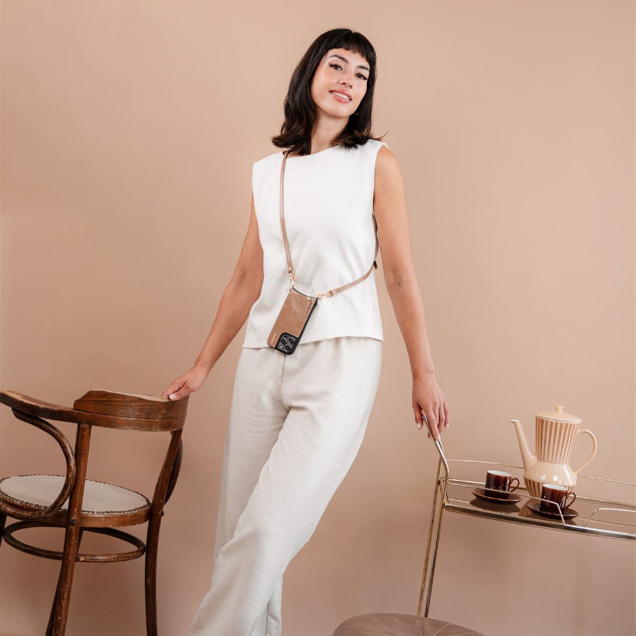 iPhone Case | Mocha showcased on a stylish model, highlighting its fashion and functionality in a chic setting.