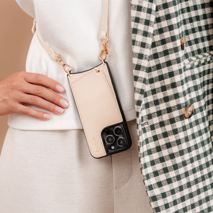 iPhone Case | Vanilla elegantly showcased on a stylish outfit with a strap, blending fashion and function.