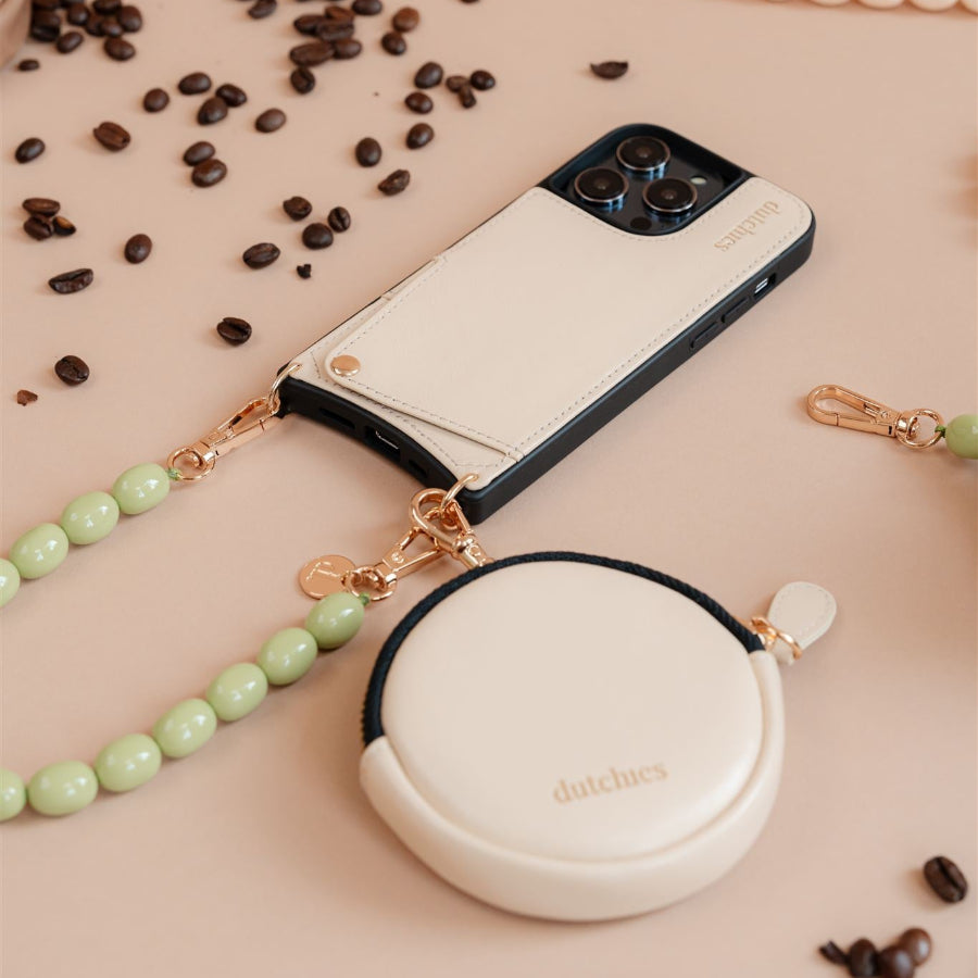 Mini Phone Bag Emma | Vanilla placed next to a phone, showcasing its stylish design and functionality.