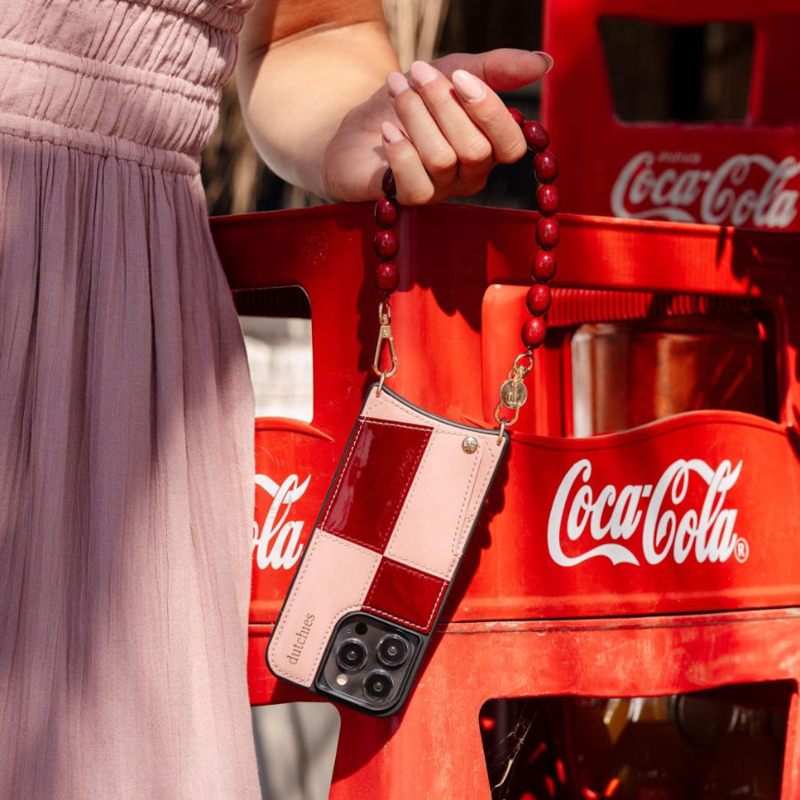 iPhone Case | Gloss Lollipop featuring a stylish design with a strap and cardholder, perfect for modern protection.