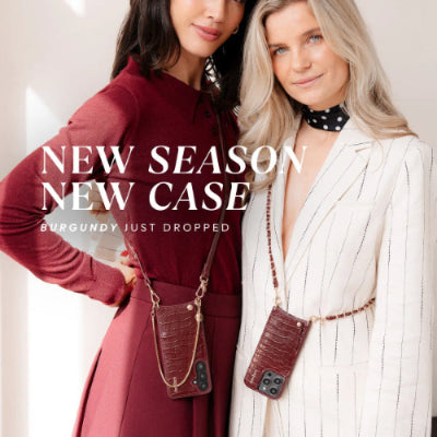 Two women wearing burgundy phone cases with text 'NEW SEASON NEW CASE' and 'Burgundy Just Dropped'.