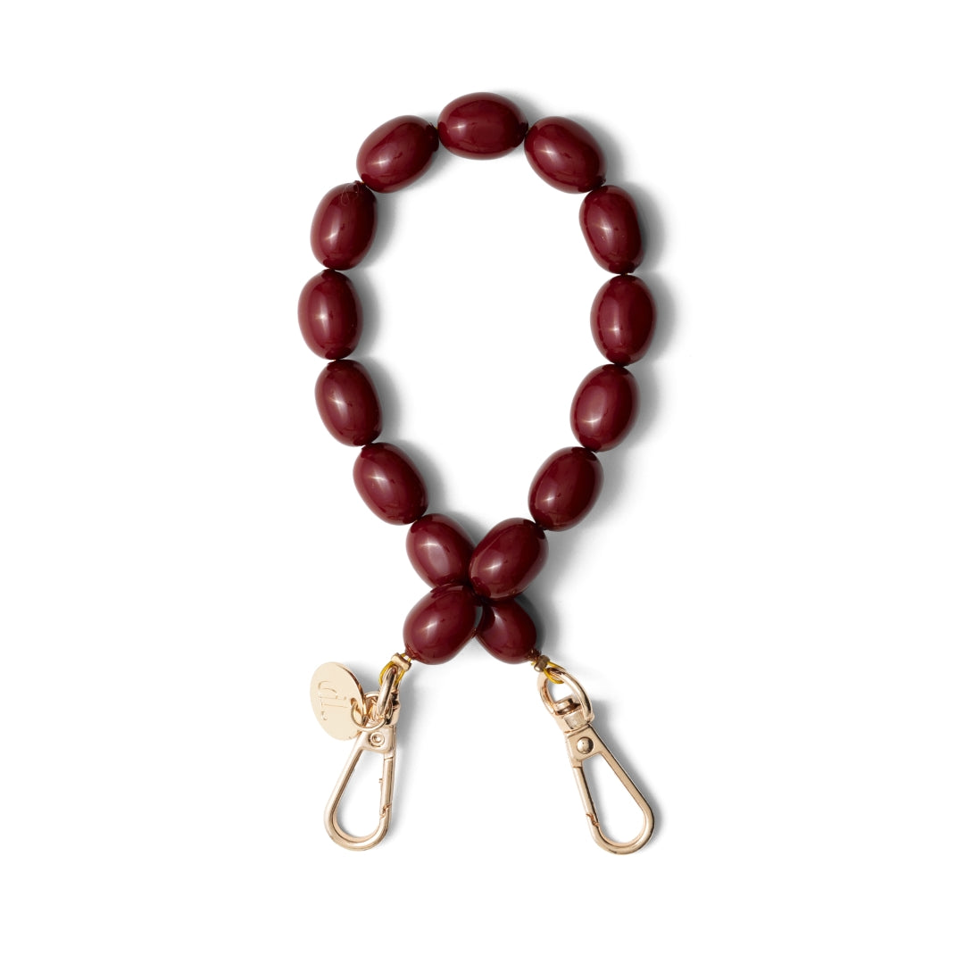 Phone Charm | Beaded | Charley in burgundy with gold clips, featuring a unique beaded design for stylish phone accessories.