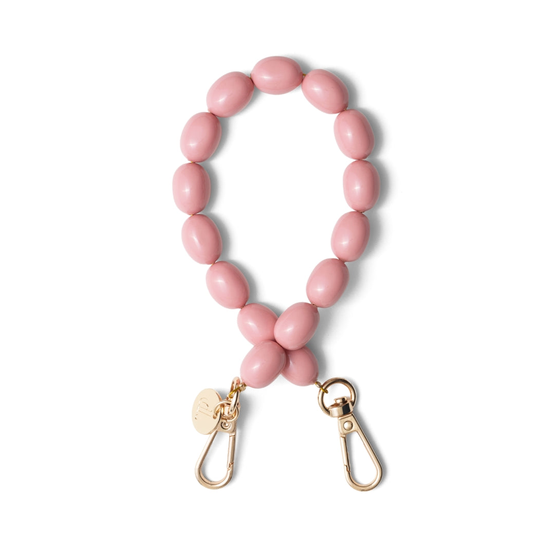 Pink phone charm made from high-quality beads, part of the Power Women collection, stylishly crafted to accessorize your phone.