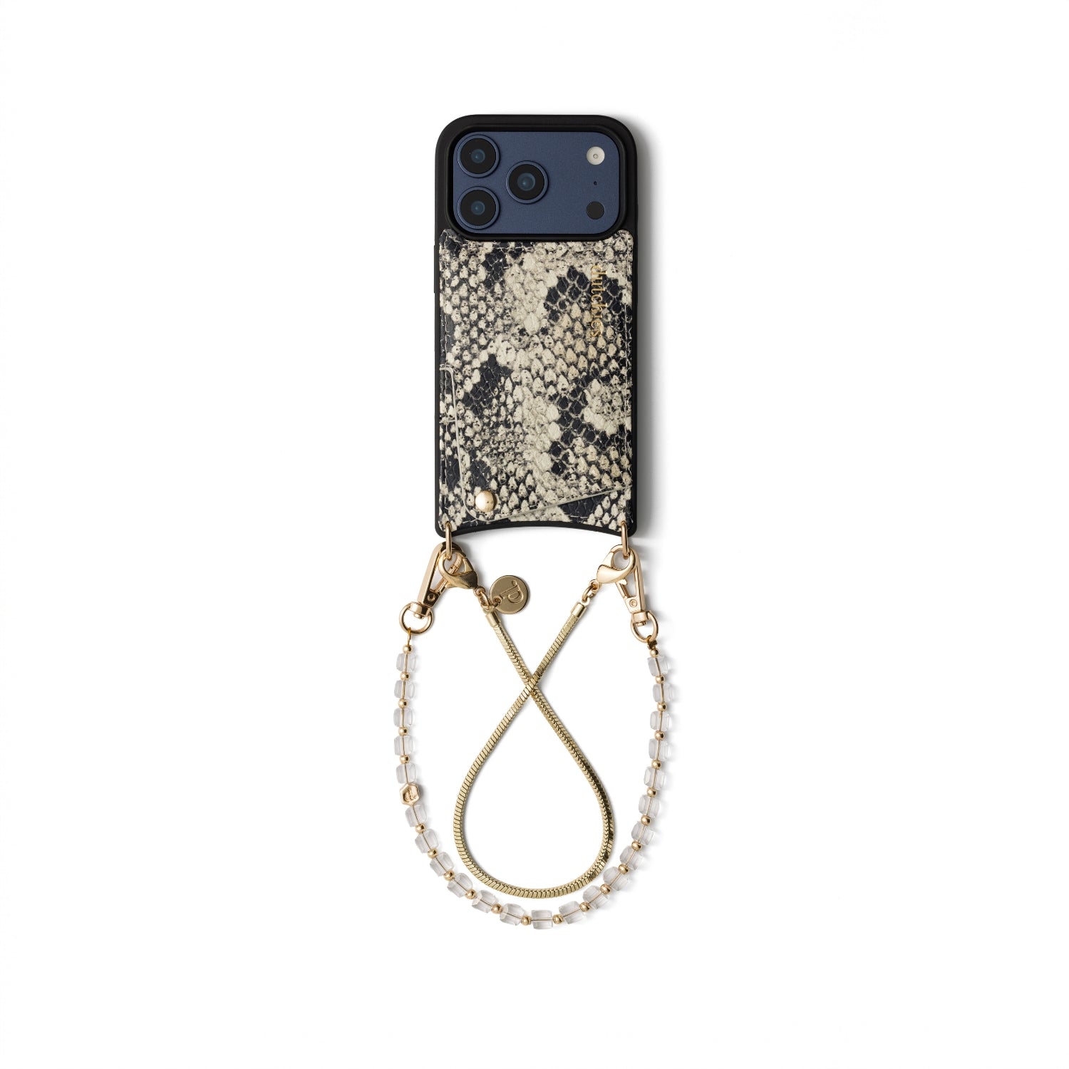 A phone case with a black and beige snakeskin pattern, featuring a gold-tone metal ring and a beaded wrist strap, shown on a plain white background.