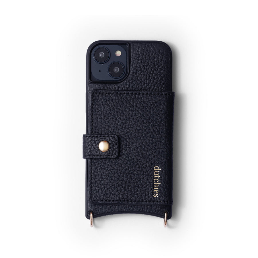 A black leather iPhone case with a Magsafe design, featuring a camera cutout at the top, a front flap, and golden details. The brand 'Dutchies' is visible on the case.