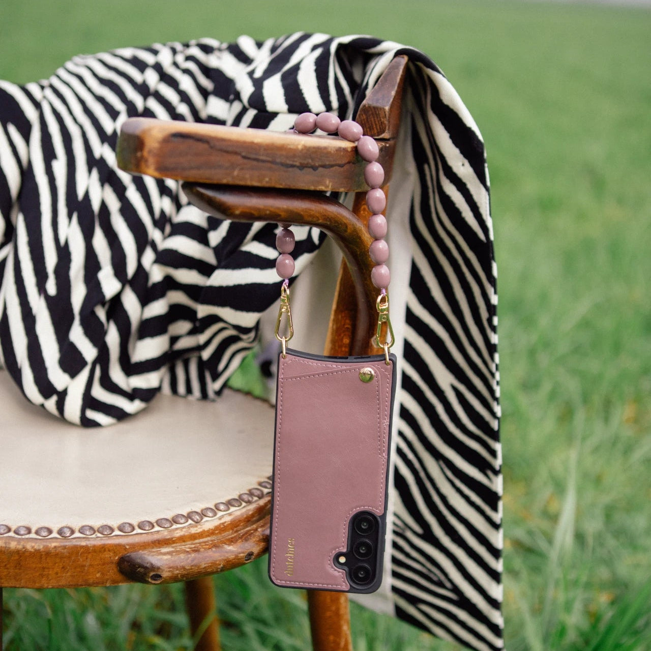 Samsung Case | Mauve hanging on a chair with a stylish black and white striped blanket.