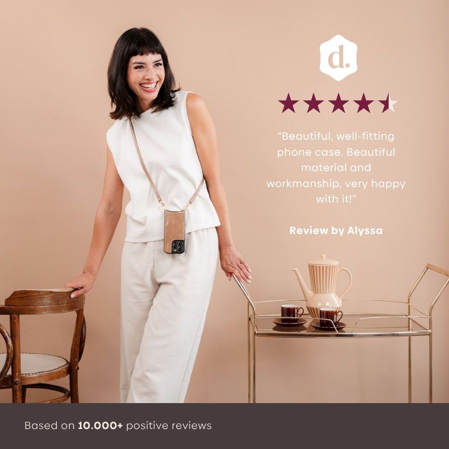 iPhone Case | Mocha showcased by a satisfied customer, enjoying its stylish design and functionality in a chic setting.