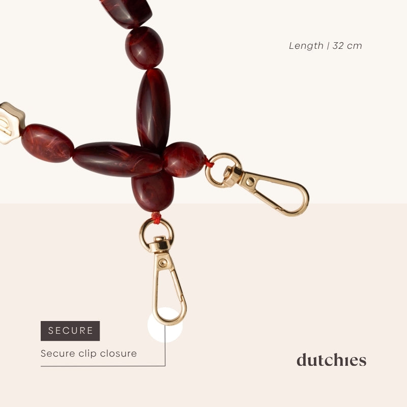 Phone Charm | Beaded | Stevie showcasing a secure clip closure and stylish red beads.