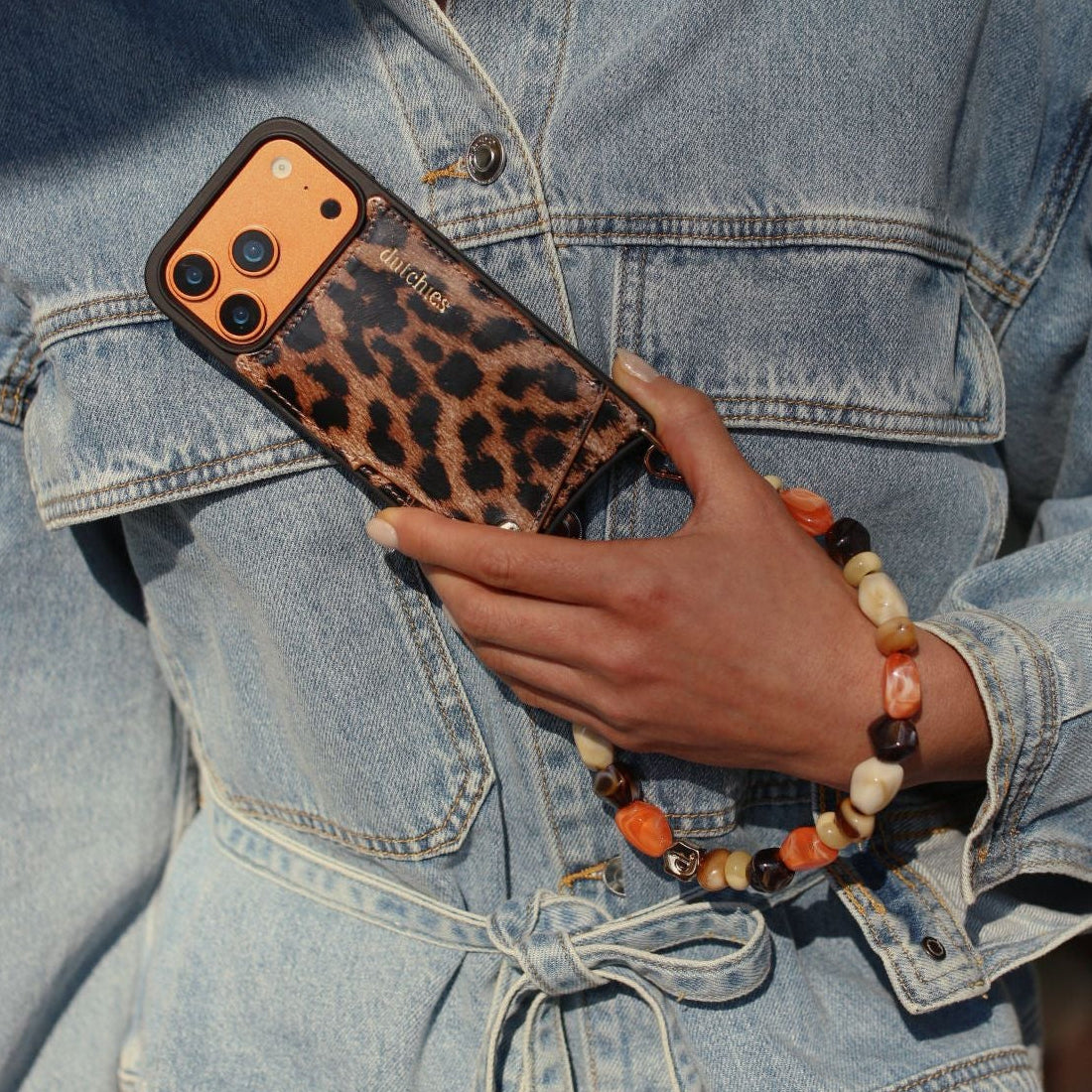Phone Charm | Beaded | Sonia displayed with a stylish leopard print phone case and denim jacket.