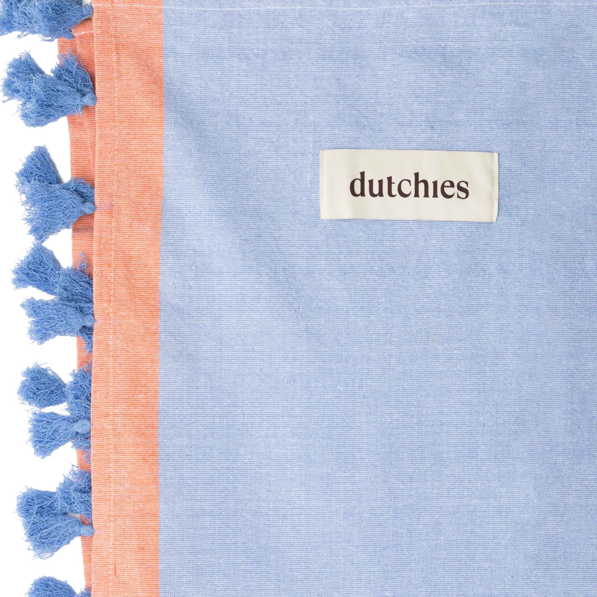 Hamam towels in blue and orange with tassels, perfect for your beach bag and summer outings.
