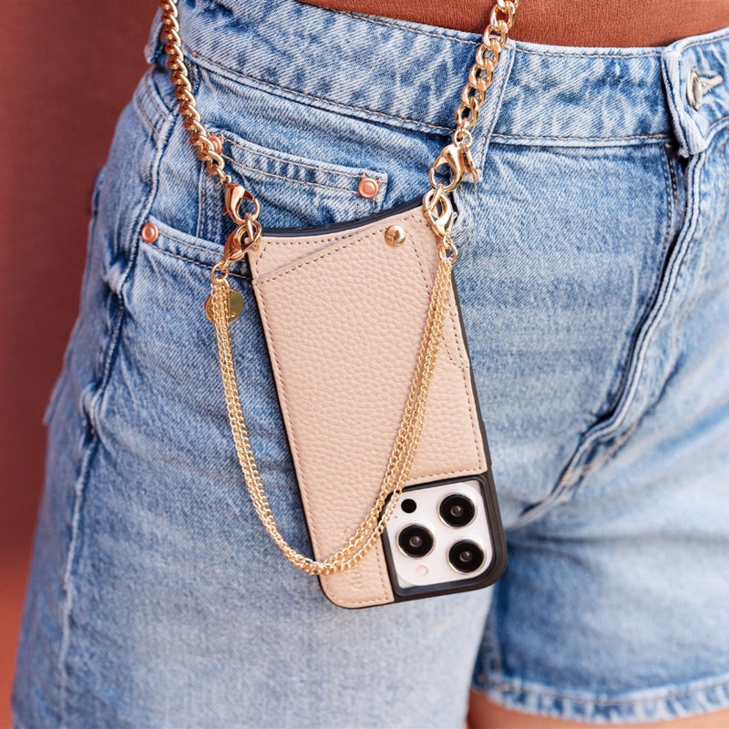 Phone Charm | Gold | Danish attached to stylish denim shorts, adding flair and function to any outfit.