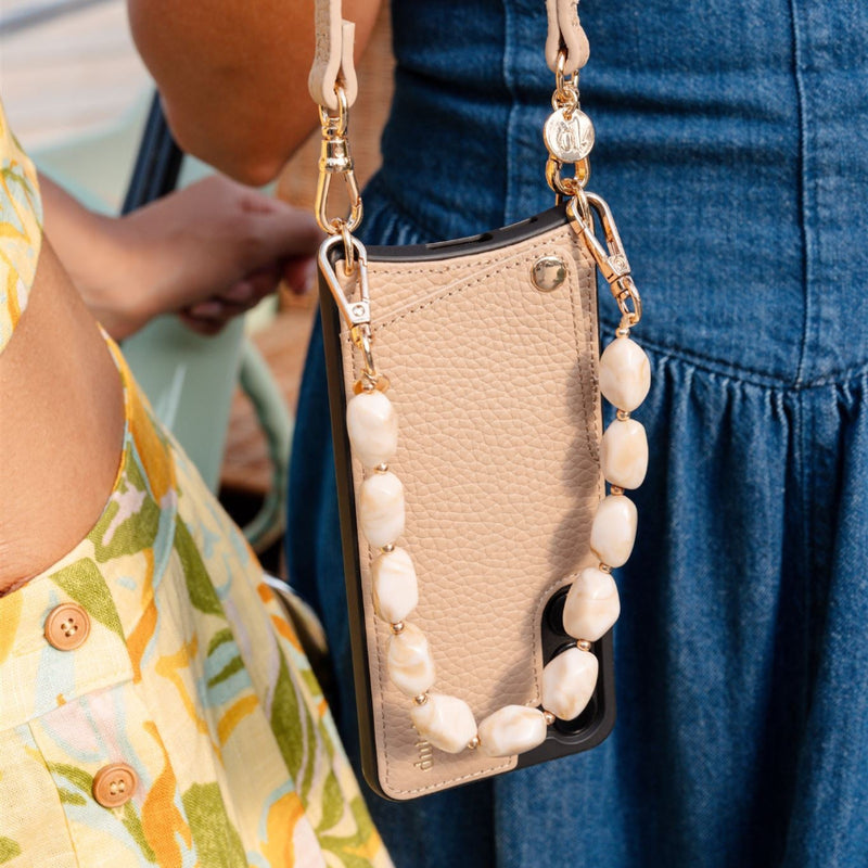 Beige Mobile Phone Charm with pearls attached to a stylish phone case, featuring the Phone Charm | Beaded | Jane.