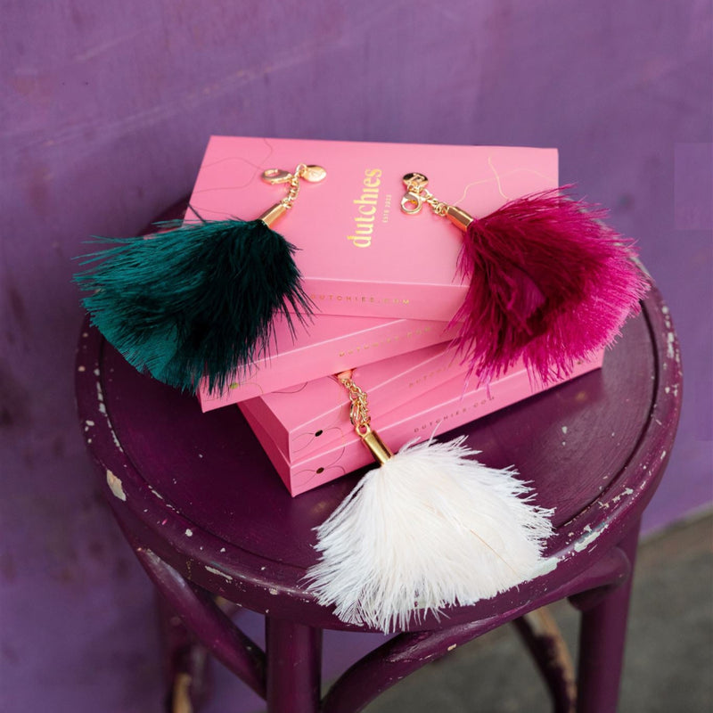 Vavavoom | Keychain featuring fluffy ostrich feather charms in vibrant colors on a pink box.
