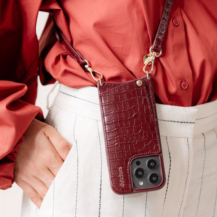 iPhone Case | Burgundy featuring a cardholder and a stylish strap, perfect for on-the-go functionality.