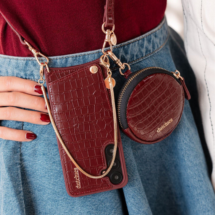 Luxury set | iPhone | Burgundy featuring a stylish phone case with cardholder and matching circular pouch.