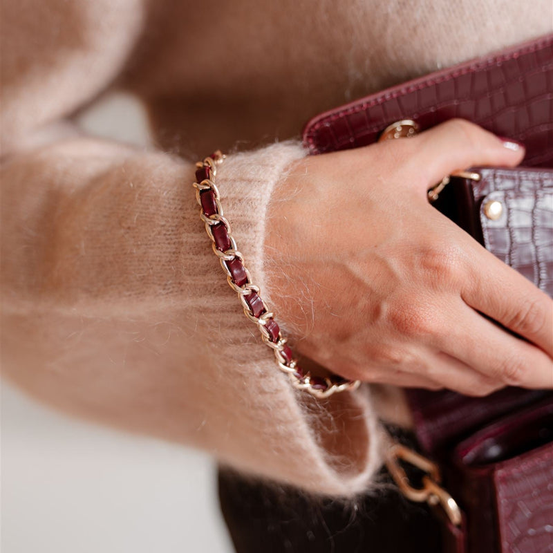 Fashionable Phone Charm | Italian | Burgundy paired with a stylish handbag and cozy sweater.