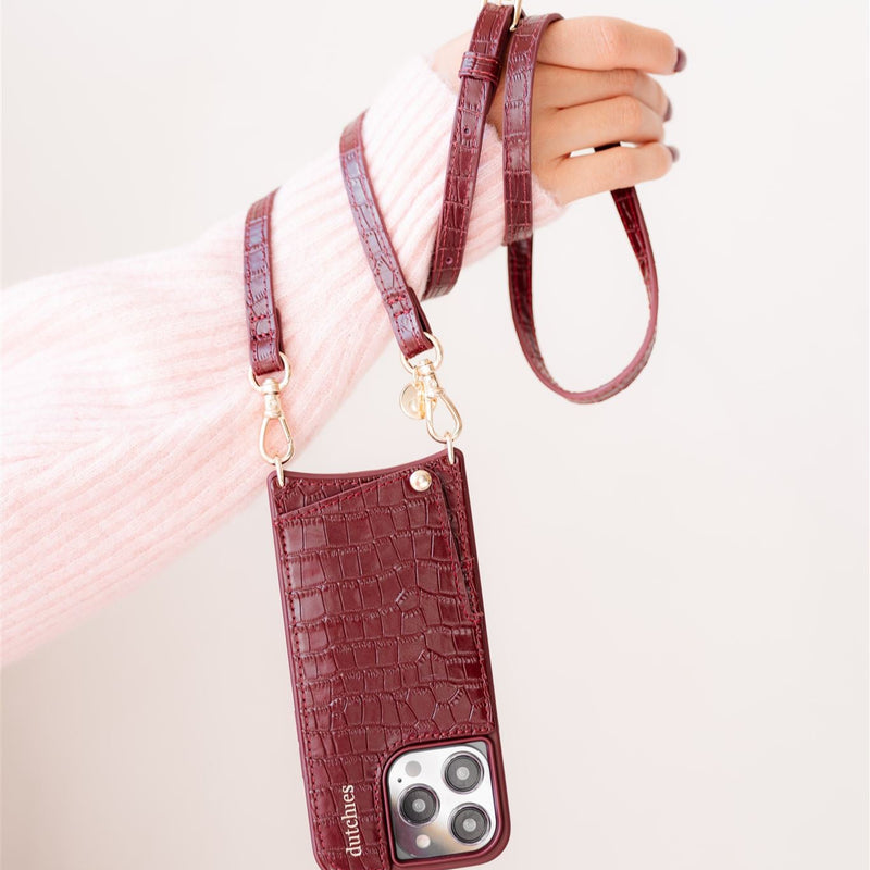 Classic set | iPhone | Burgundy phone case with cardholder and strap for stylish storage.