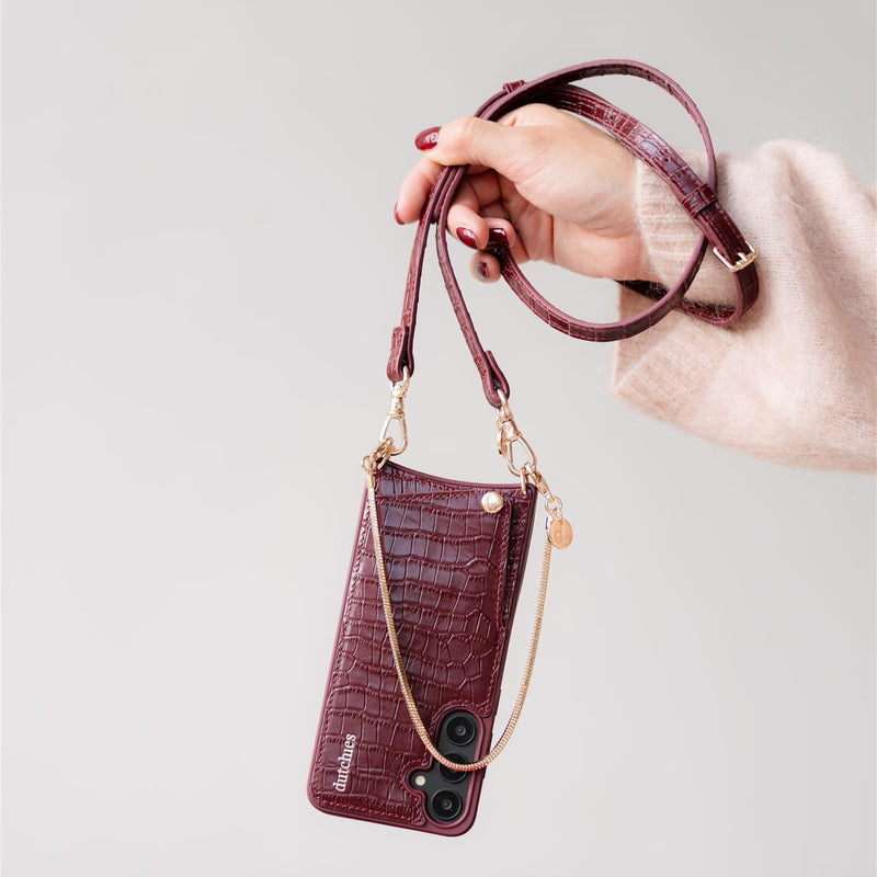 Slimline | Strap | Burgundy with a stylish phone case attached, perfect for hands-free convenience.