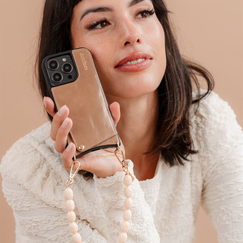 Woman holding Phone Charm | Beaded | Gwen phone charm with stylish beads.