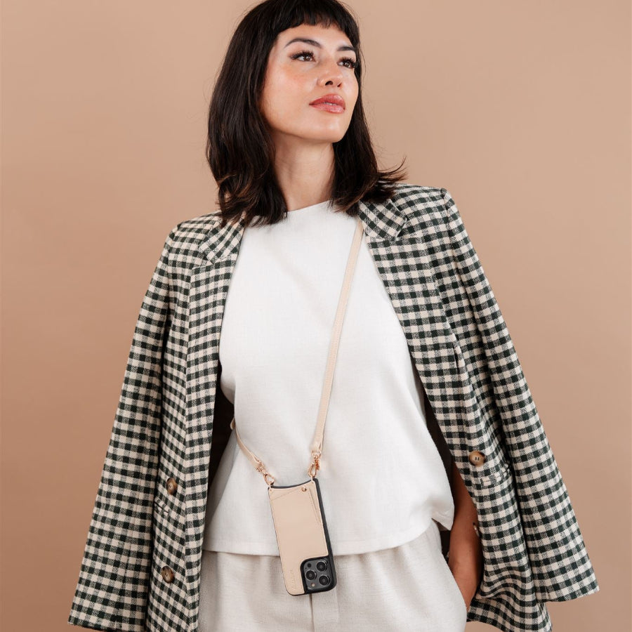 Classic Set | iPhone | Vanilla showcased on a trendy model wearing a stylish blazer with beige accents.
