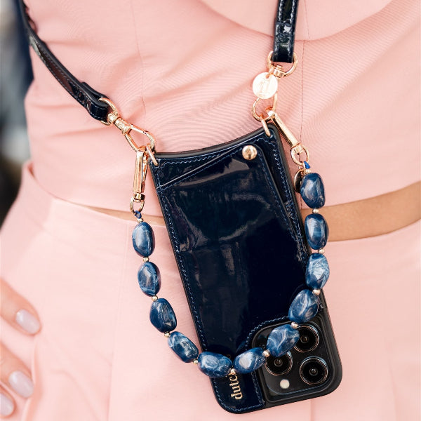 Phone Charm | Beaded | Diana: Stylish blue mobile phone charm with elegant beads on a trendy phone case.