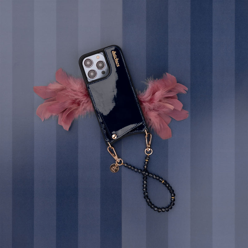 Phone Charm | Beaded | Grace attached to a stylish phone case with blue pearls and pink feathers.
