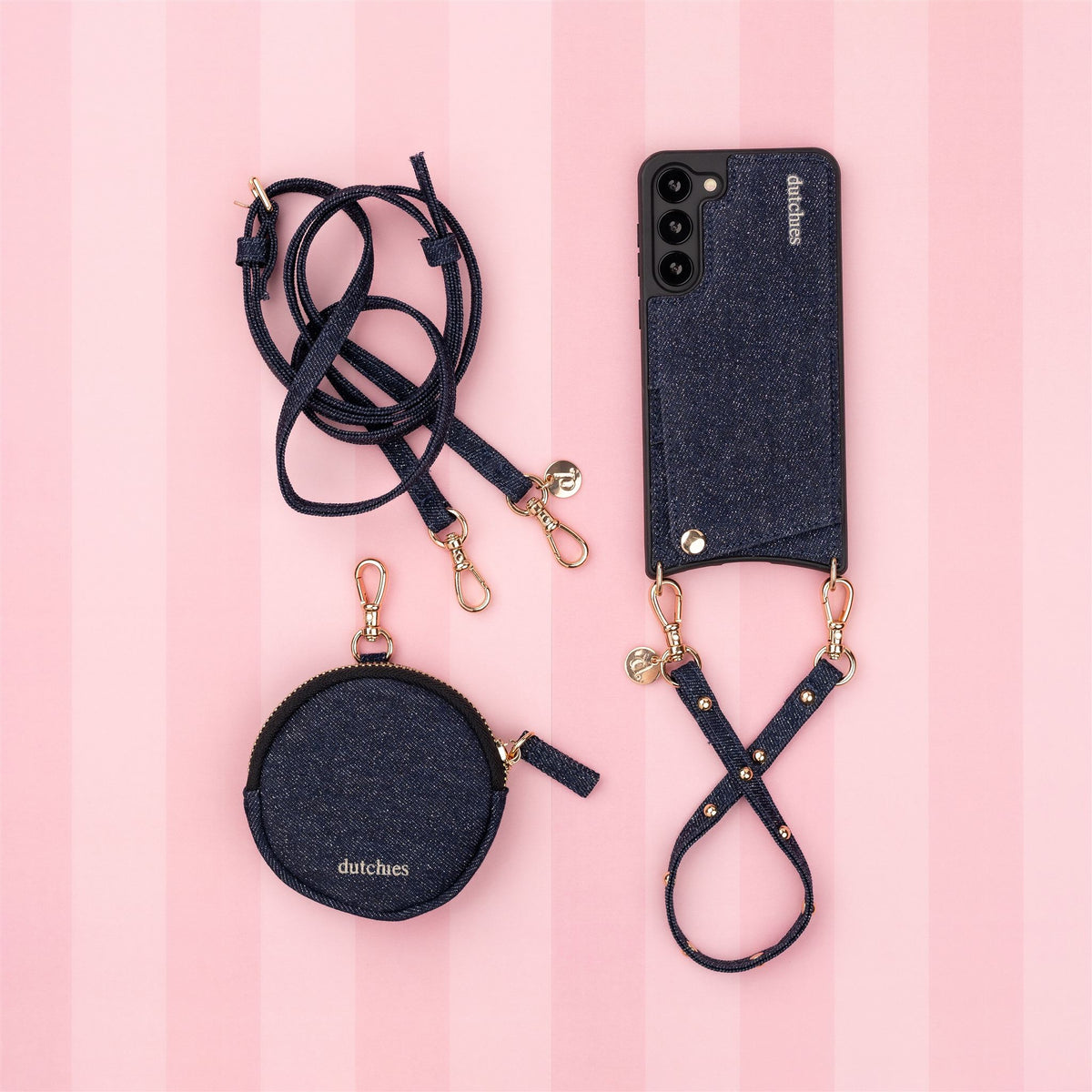 Luxury set | Samsung | Denim Glitter with phone case, strap, and pouch on a pink striped background.