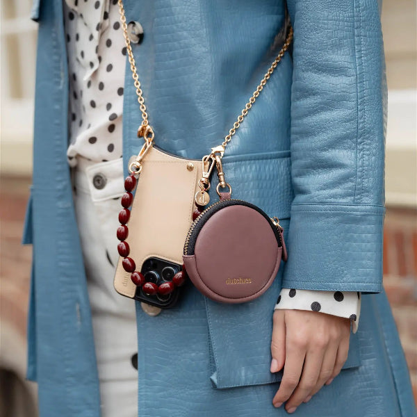 Mini Phone Bag Emma | Mauve attached to a stylish outfit with additional accessories and a chic leather pouch.