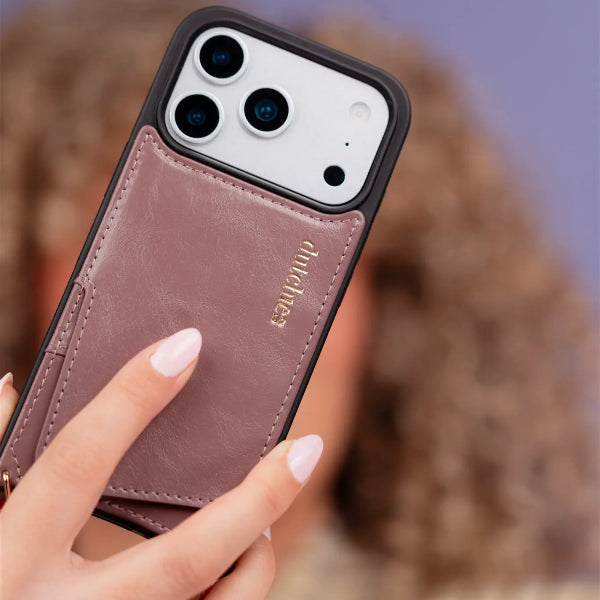 iPhone Case | Mauve held by a hand, showcasing its leather cardholder and sleek design.
