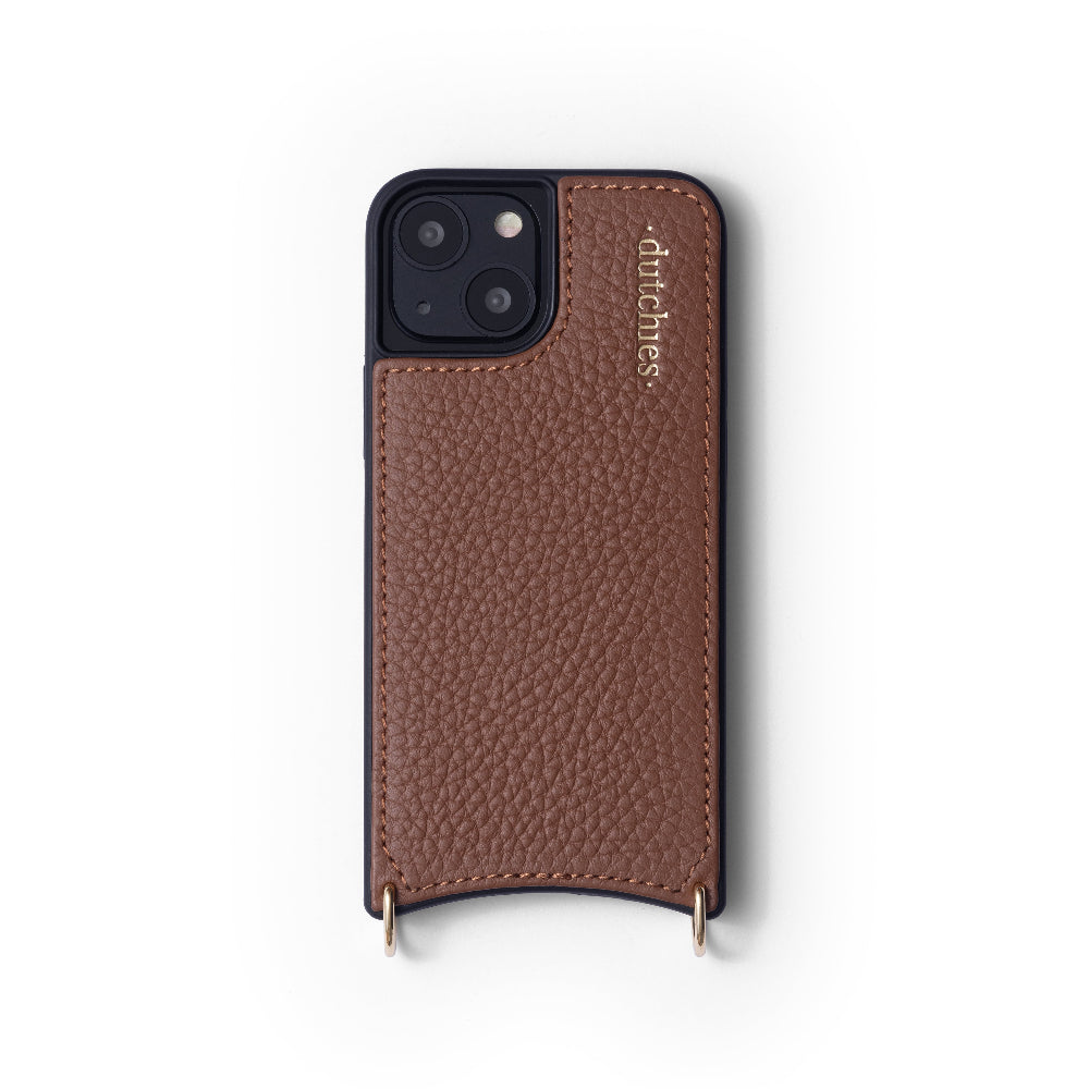 A brown Dutchies iPhone case made of genuine leather with a cardholder, metal finishes, and two rings for attaching a strap.
