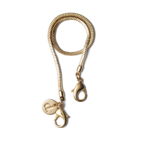 Phone charm | Gold | Indian - elegant golden hand-strap for your phone, featuring smooth, chic design.