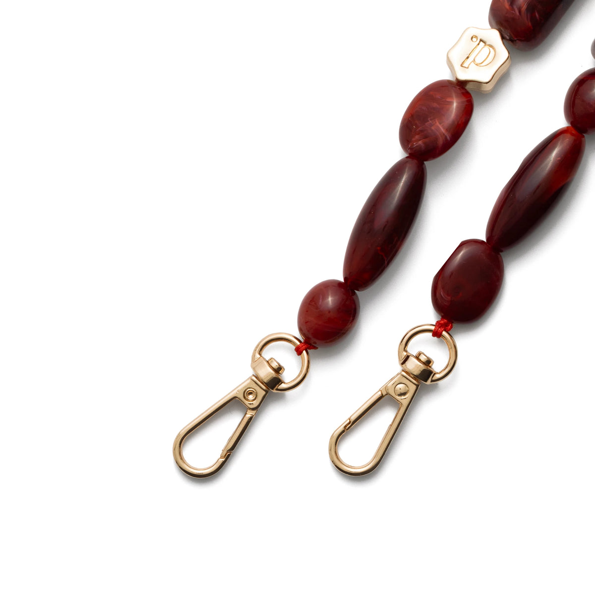 Phone Charm | Beaded | Stevie - close-up of red beads and gold clasps in stylish design.