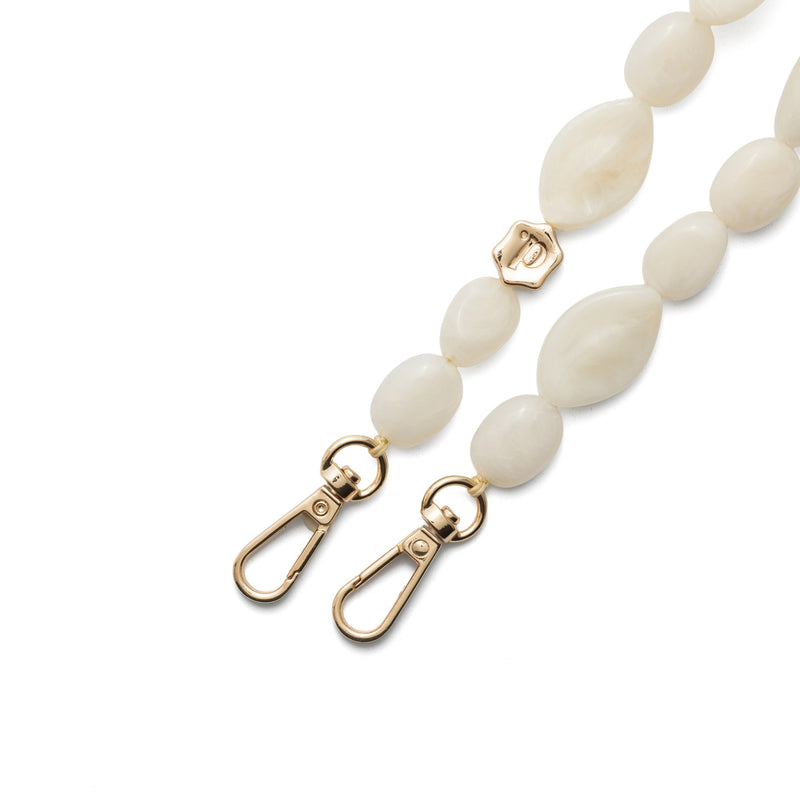 Close-up of Phone Charm | Beaded | Sally strap featuring elegant white beads and gold lobster clasps.
