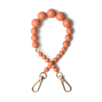 Phone Charm | Beaded | Freya: A stylish orange phone charm strap with gold clasps.