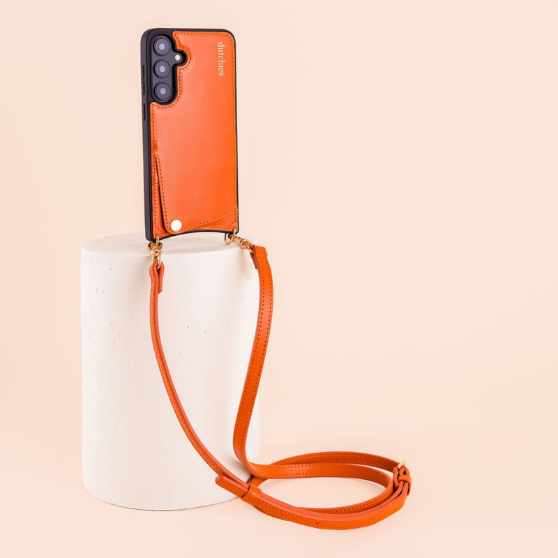 Classic set | Samsung | Orange - Stylish leather phone case with strap elegantly displayed.