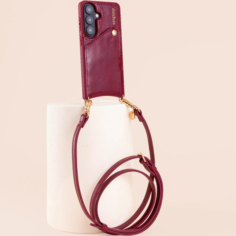Classic Set | Samsung | Raspberry Red phone case with strap displayed on a minimalist pedestal.