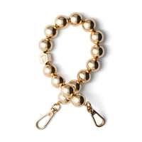 Gleaming gold Phone Charm | Beaded | Donna showcasing bold and glamorous design perfect for adding luxury to your style.