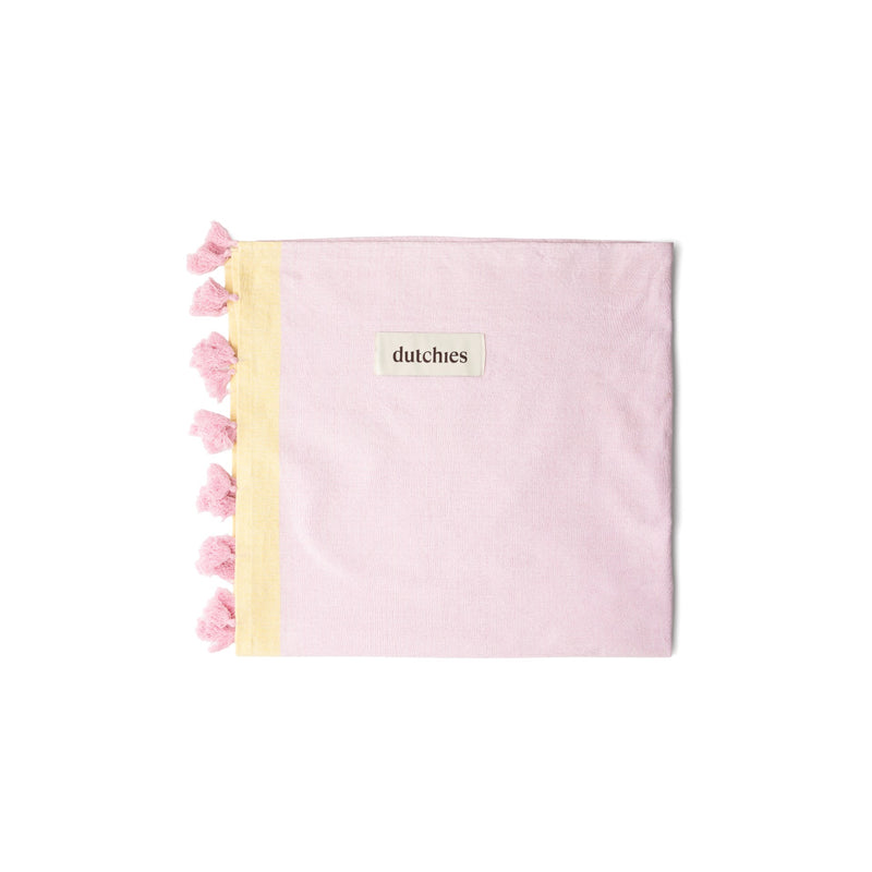 Hamam towels in soft pink with yellow trim and tassels, perfect for your beach bag and summer adventures.