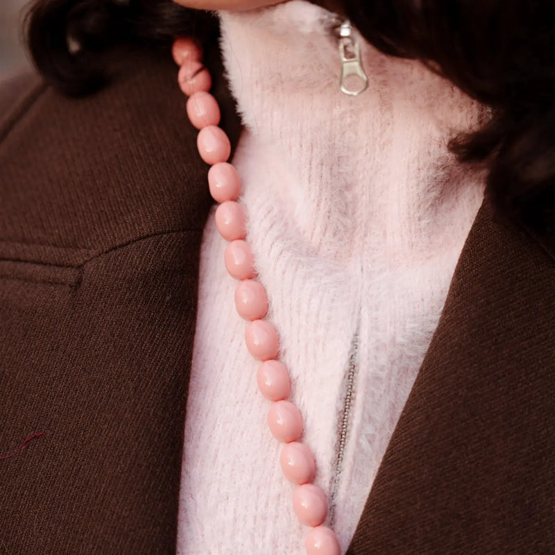 Beaded Phone Chain | Beaded | Therese worn as a stylish Pink Crossbody by a fashionable individual.