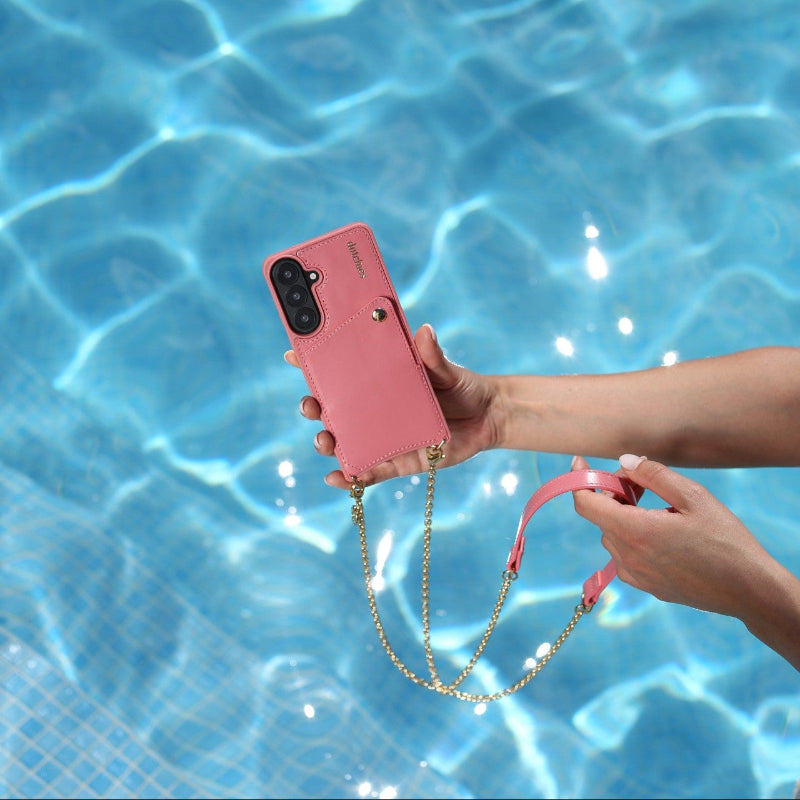 Spanish Chain Set | Samsung | Pink held by a hand above a pool, showcasing fashion and convenience.
