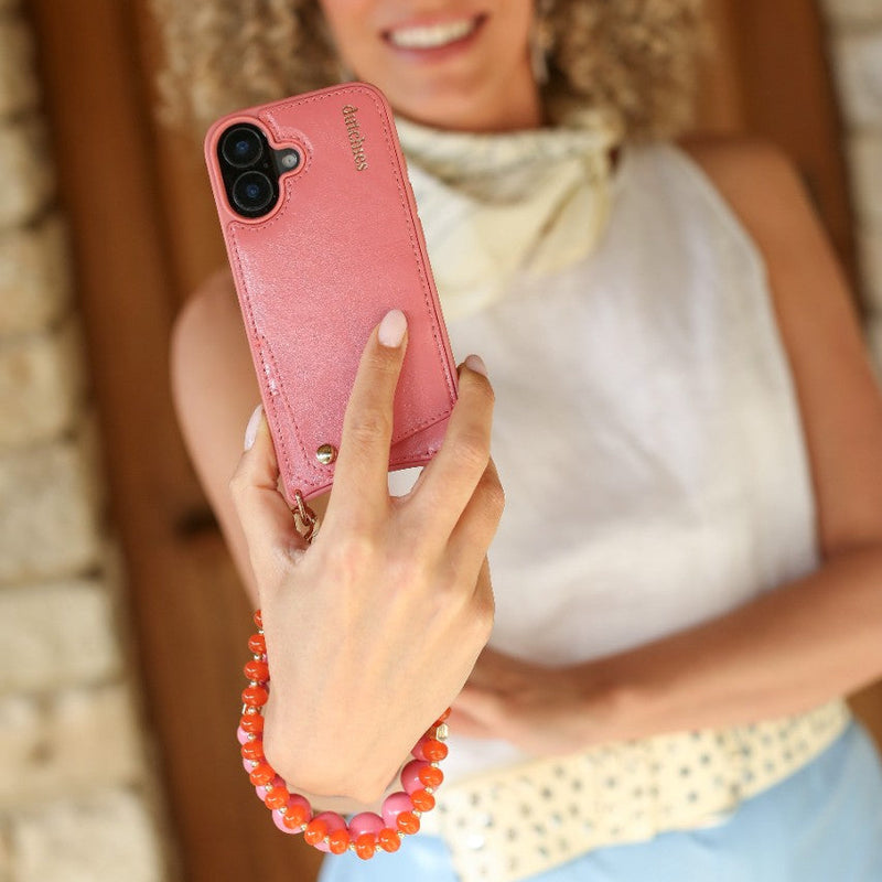 Phone Charm | Beaded | Isabella attached to a pink phone case, showcasing a stylish accessory.